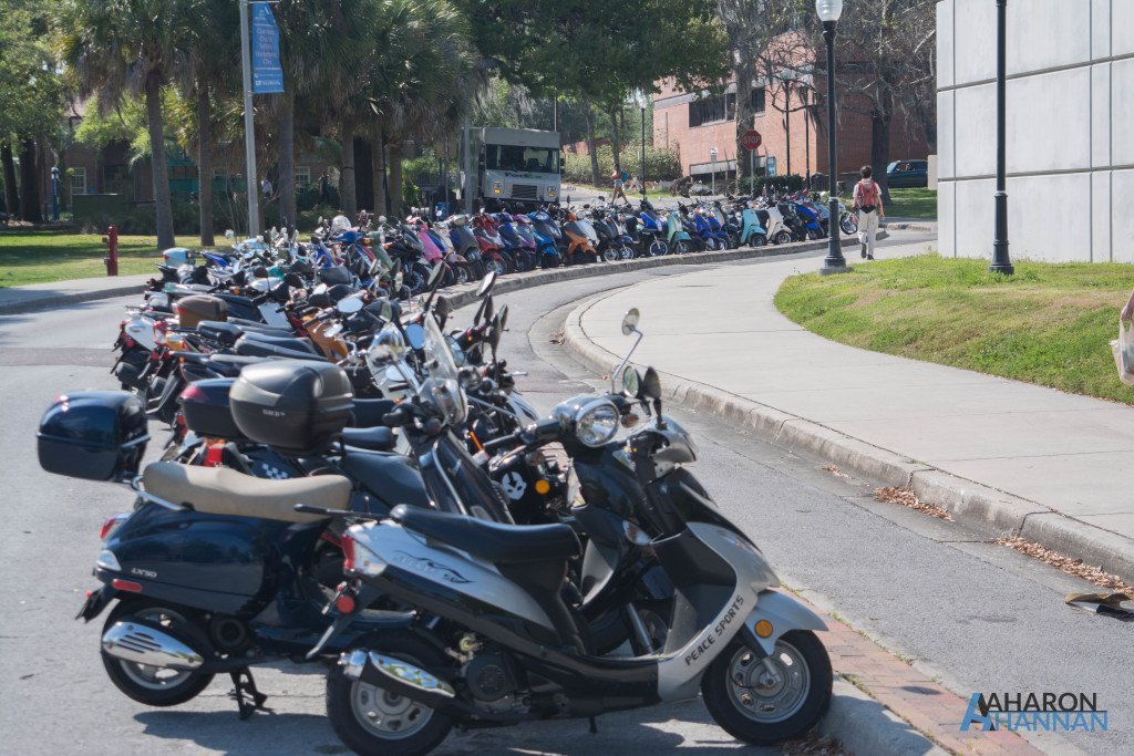 Students park their scooters in a line before they head to class